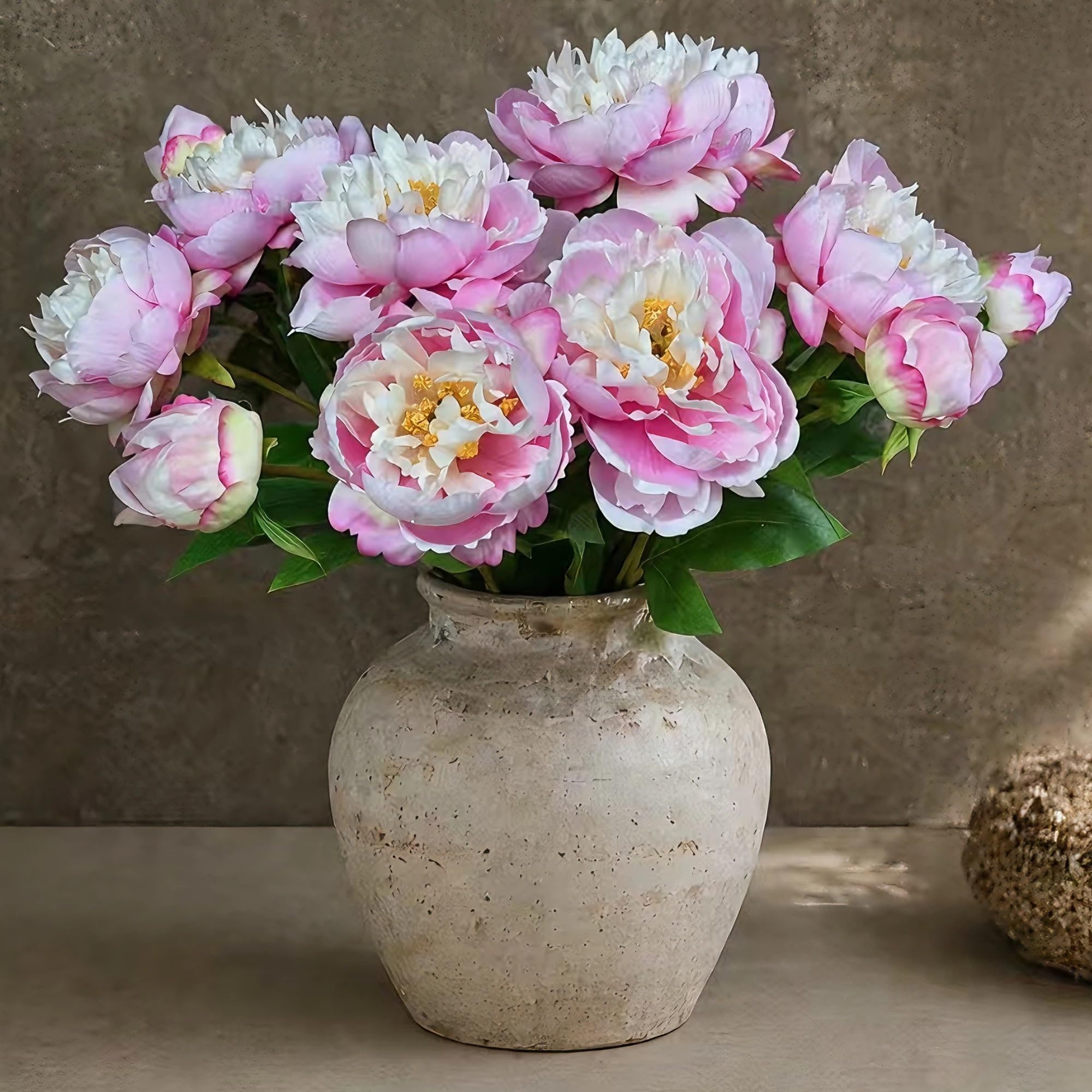 Real touch peony bouquet in a bedroom vase with soft morning light