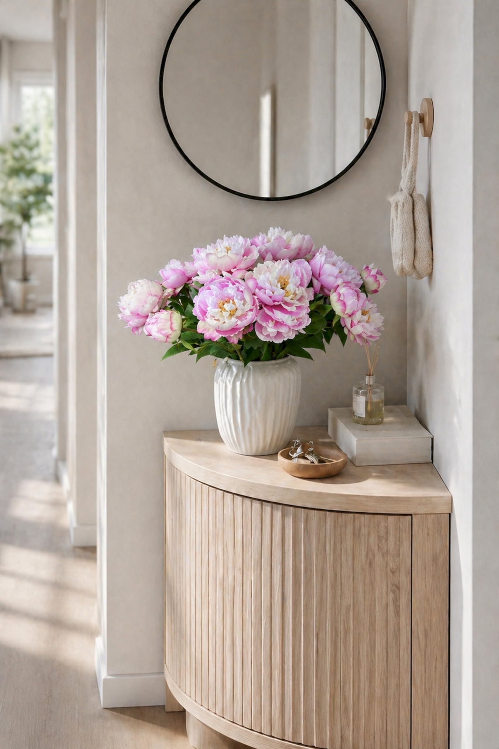 Artificial peony bouquet styled on a dining table as a statement centerpiece