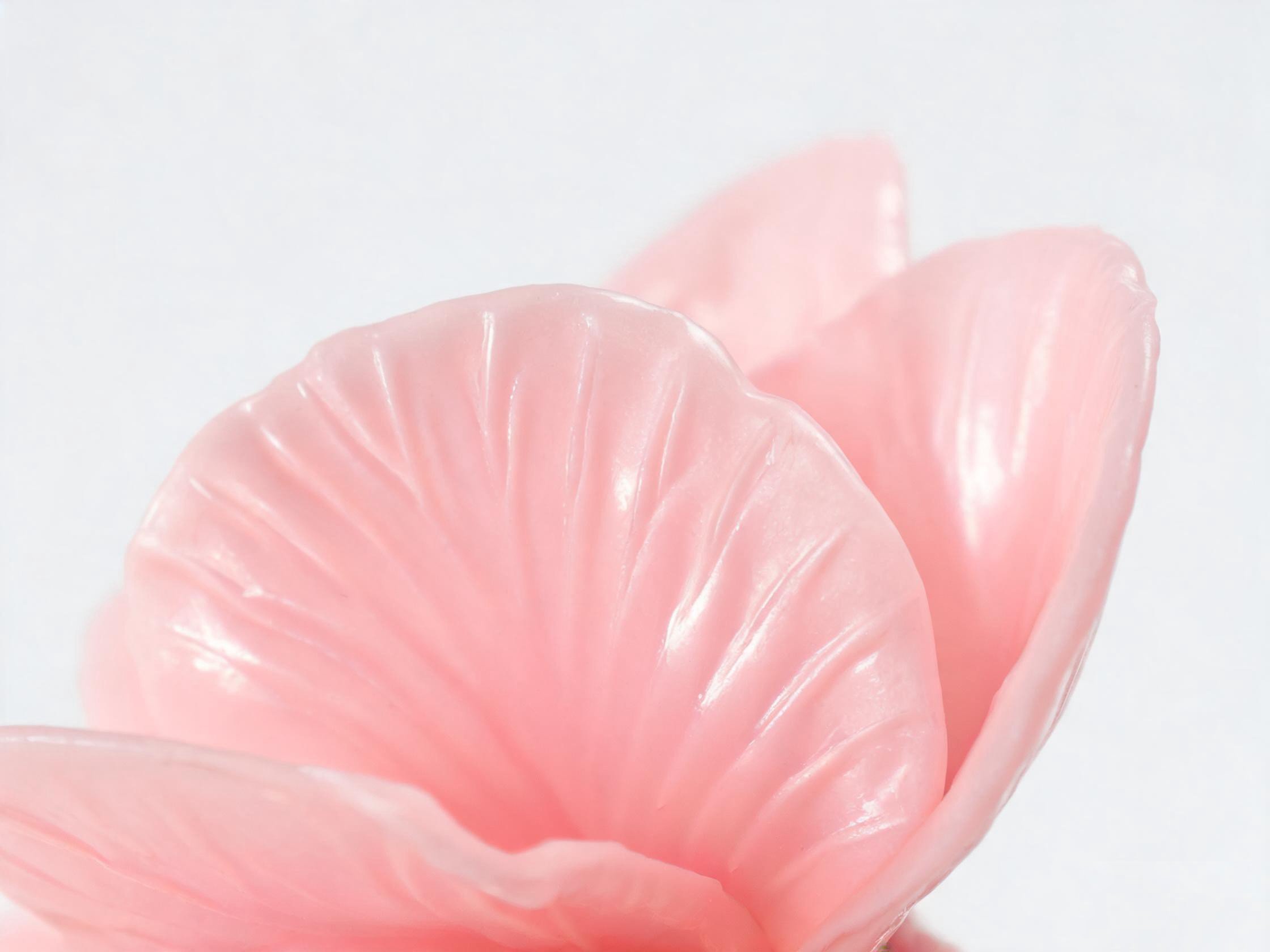 Close-up of plastic artificial flower showing molded petal texture and uniform color